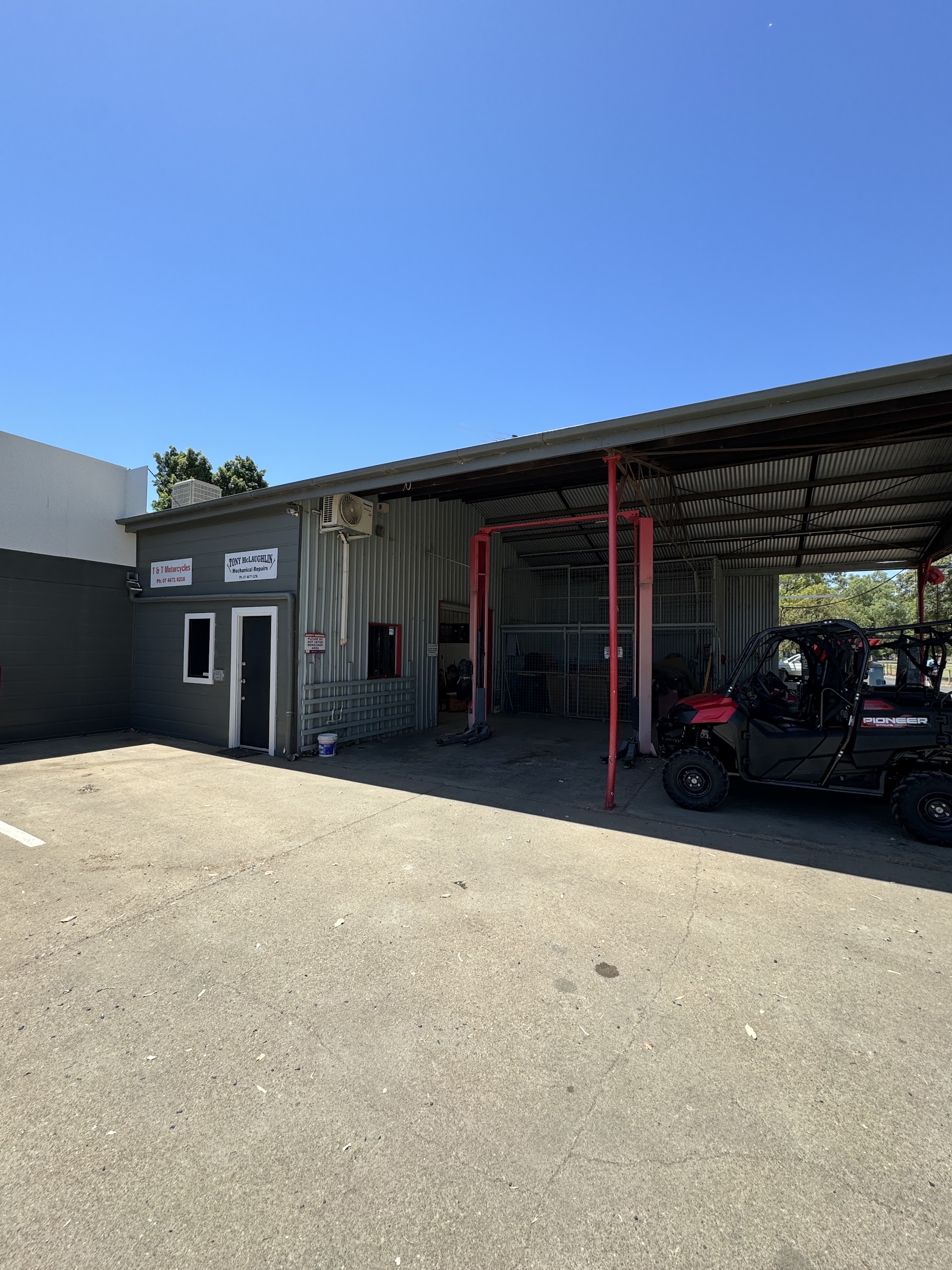 The Herbert Street frontage of the workshop with a Honda Pioneer under the awning